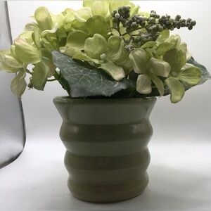 Spring green hydrangeas in ceramic green vase all attached
